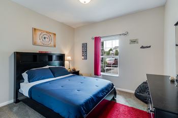 Bedroom with Large Window and Ceiling Light
